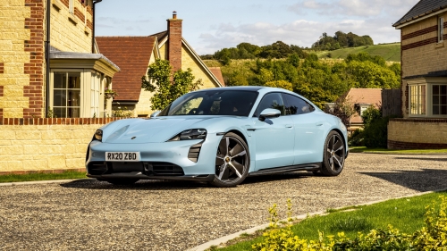 Beautiful Blue Porsche Taycan under Clear Sky