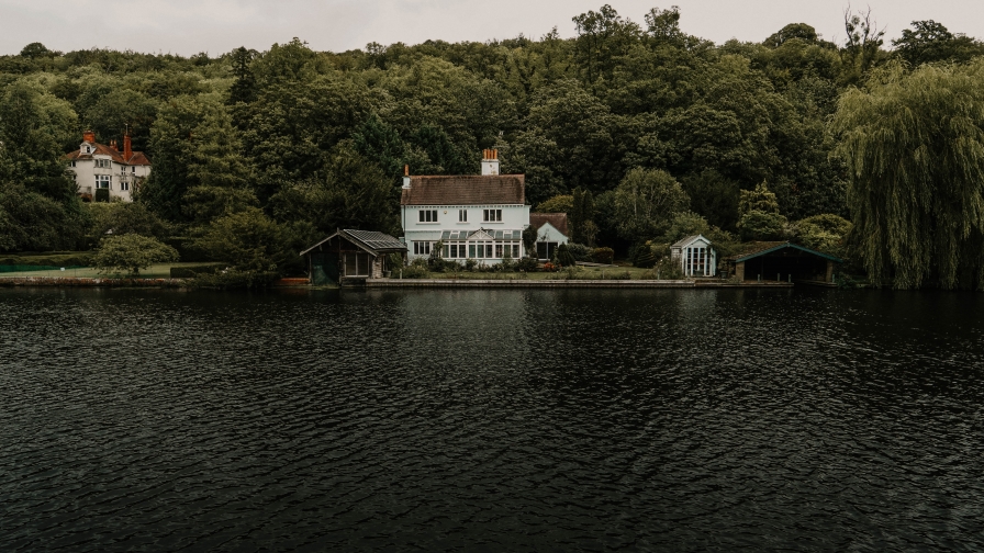 Beautiful Lake and Green Forest with Big House on Shore