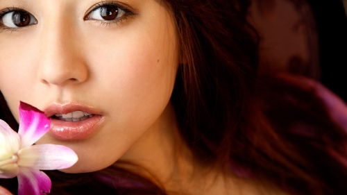 Pretty Young Asian Beauty with Pink Flower