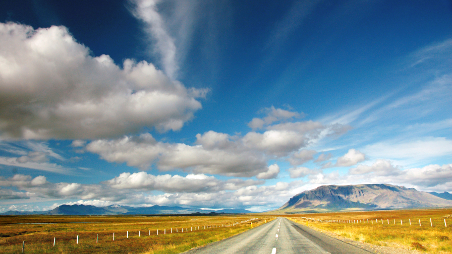 Road in Desert and Clouds in Sky