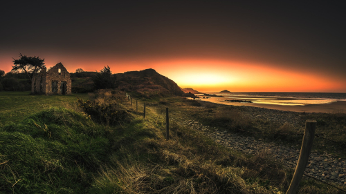 Wonderful Orange Sunset and Single House on Coast